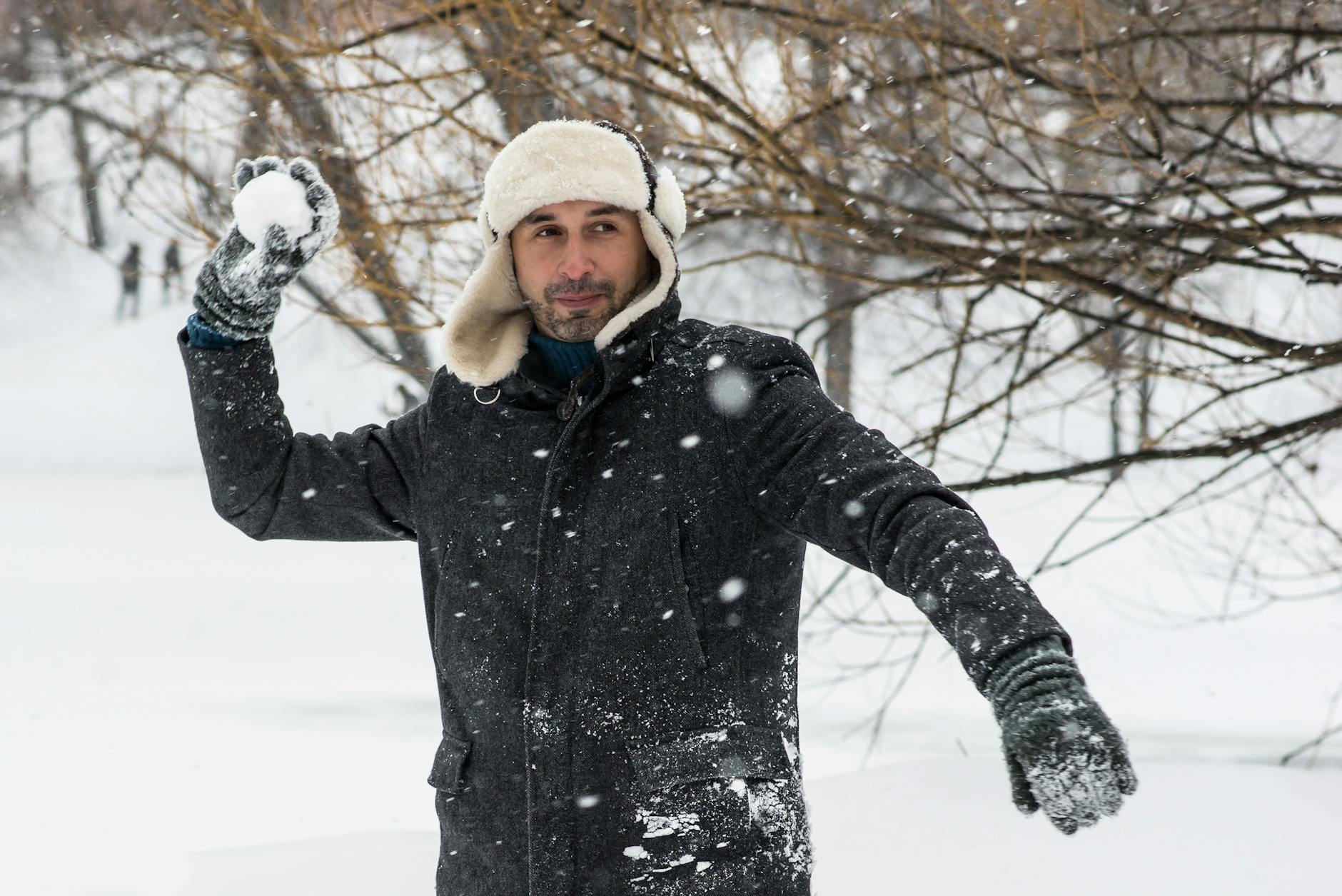 man holding snowball